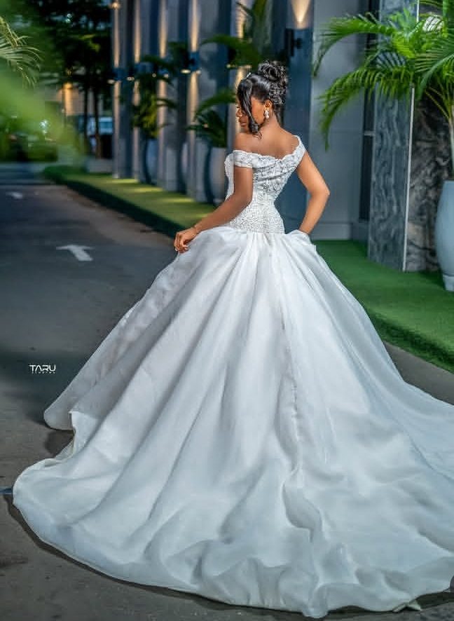 Bride twirling in an off-shoulder crystal ball gown — Gia Bridals, Port Harcourt
