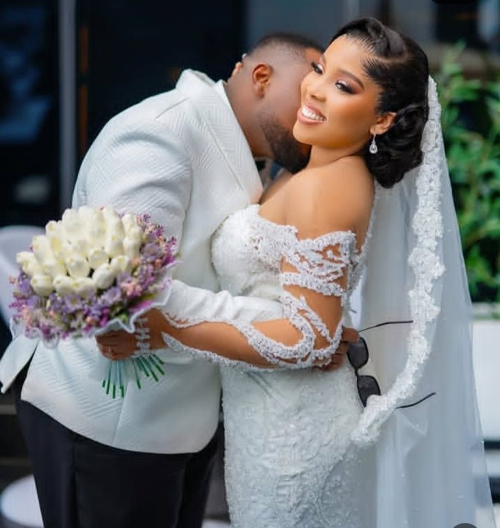 Newly-wed couple embracing after the ceremony — Gia Bridals, Port Harcourt