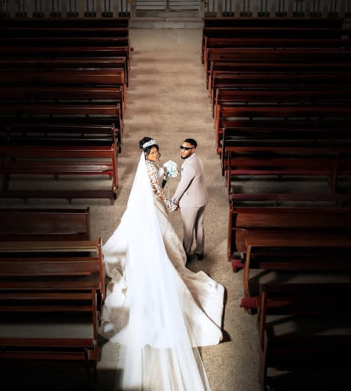 Bride and groom seen from above in the church aisle — Gia Bridals, Port Harcourt